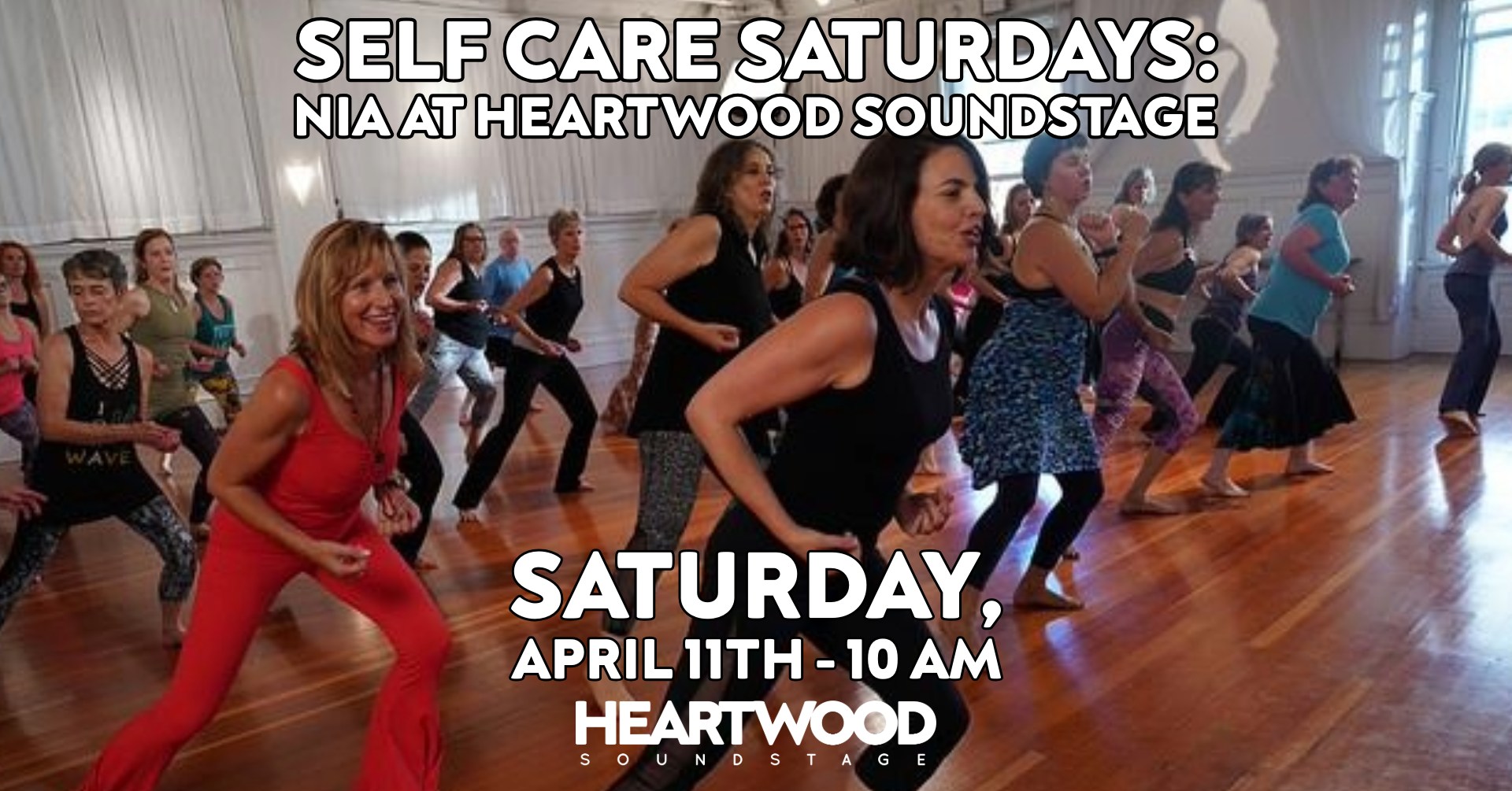 Self Care Saturdays Nia showing a class of students doing physical activity