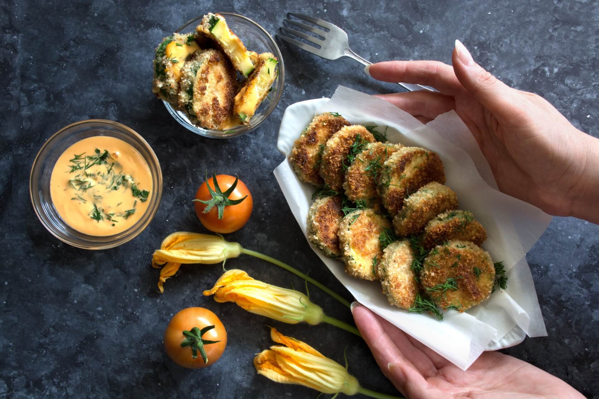 Breaded fried zucchini with tomatoes and sauce. Healthy cooking meal. High quality photo