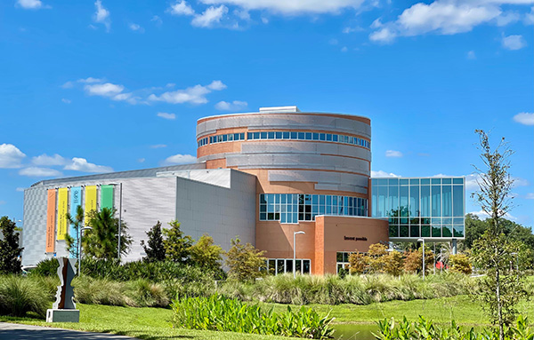 Front view of a circular brick and glass building in Alachua County, Florida. 