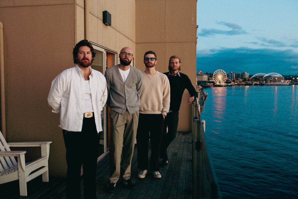 Photo of the band beside wter