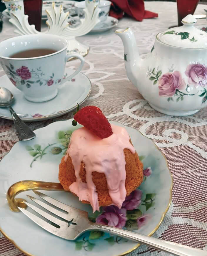 Tea set with strawberry cake dessert