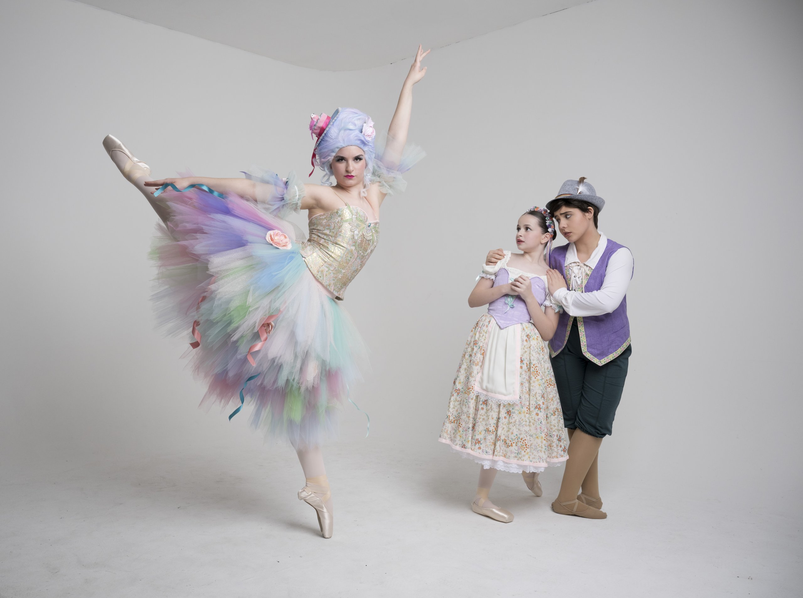 A studio photo of three young dancers dressed in costume for the ballet performance of Hansel and Gretel