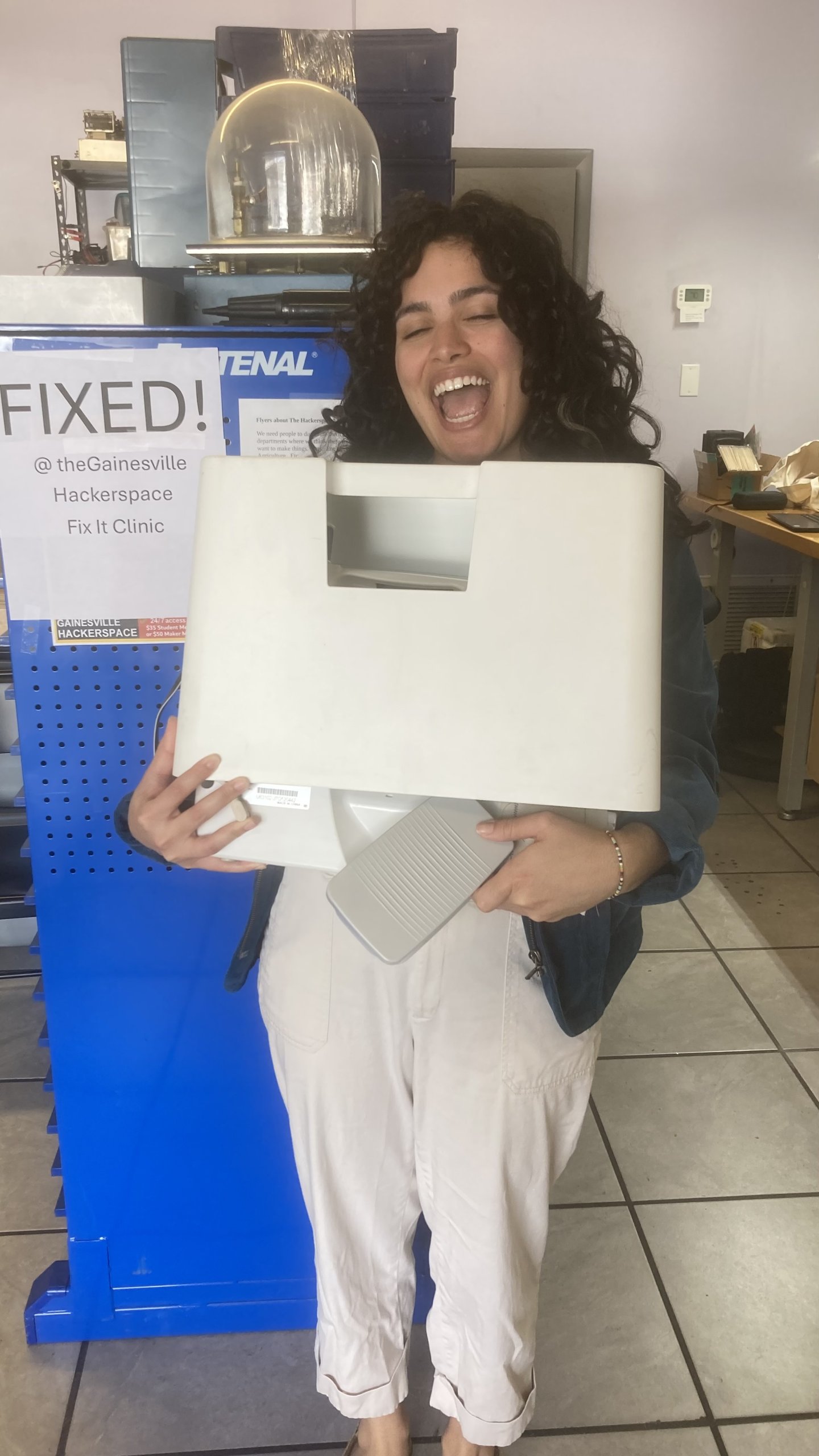 Woman shows Fixed sewing machine