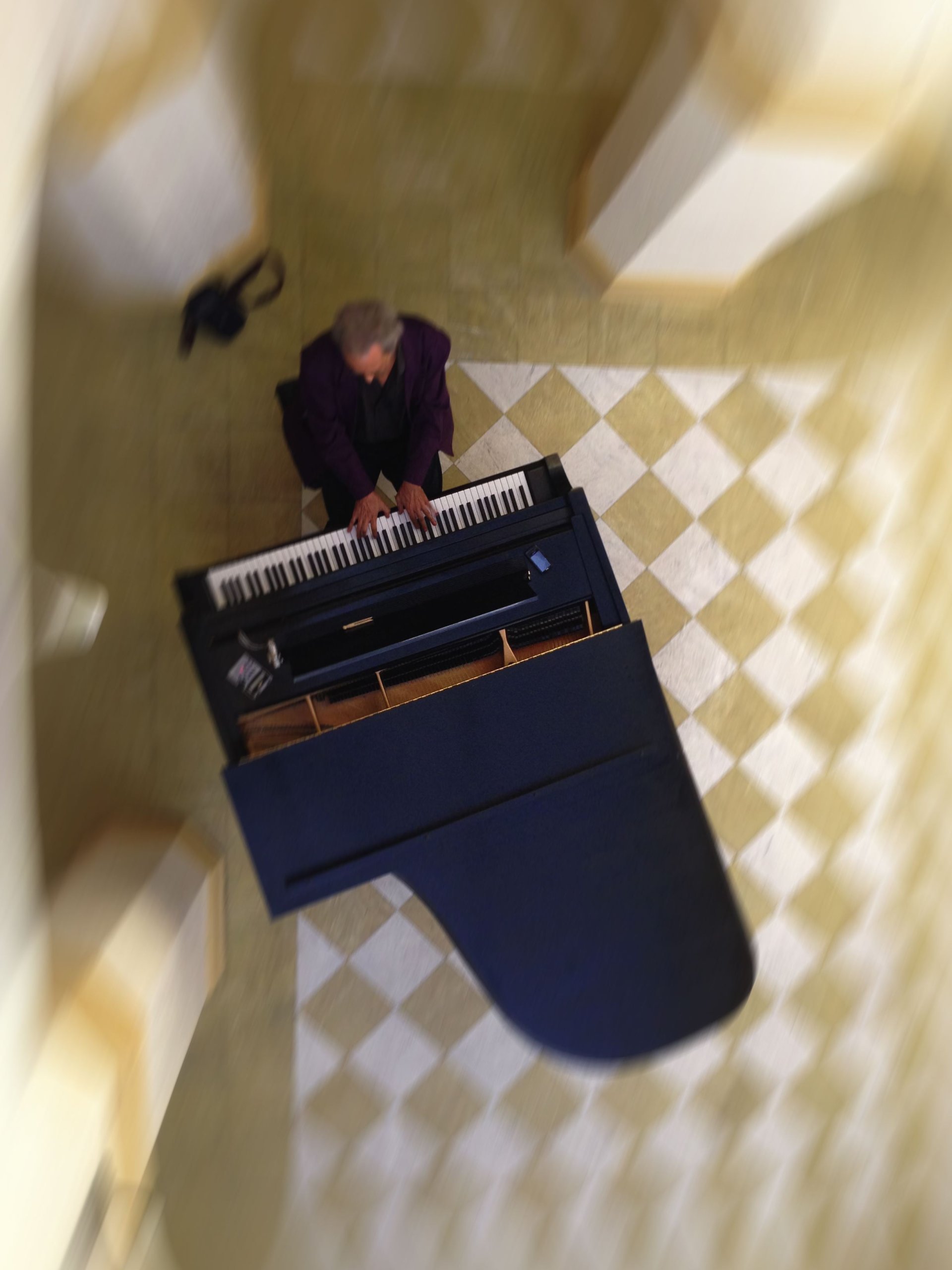 overhead view of person playing piano