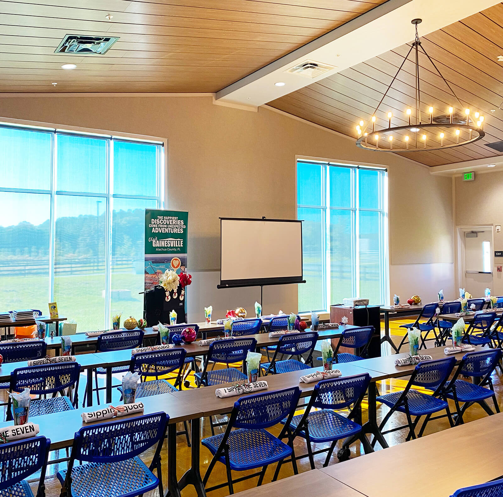 tables, chairs and podium set up at the ag auditorium