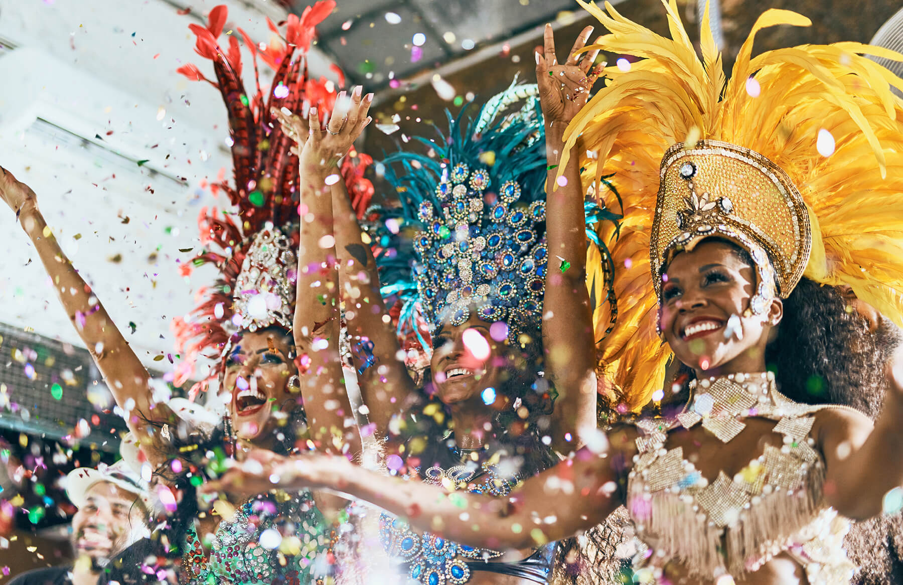 smiling people in costume at a Brazilian-themed festival