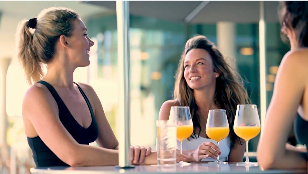 Friends enjoying mimosas at brunch.