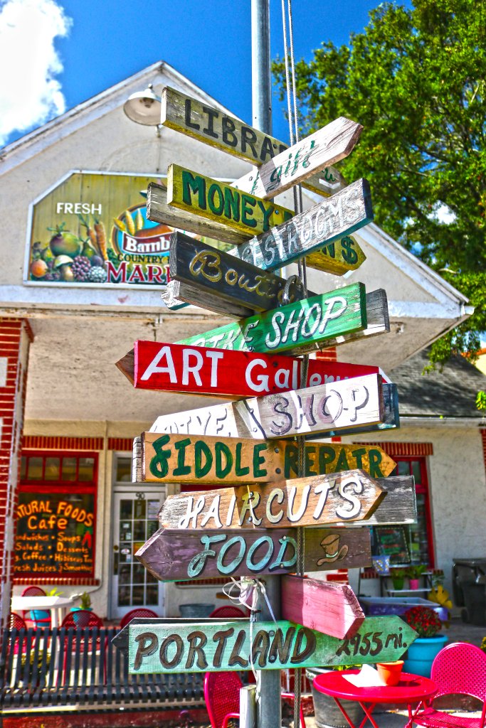 Colorful directional signs outside store