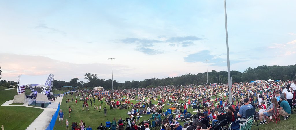 Legacy Park Amphitheatre with large crowd for the annual independence day celebration