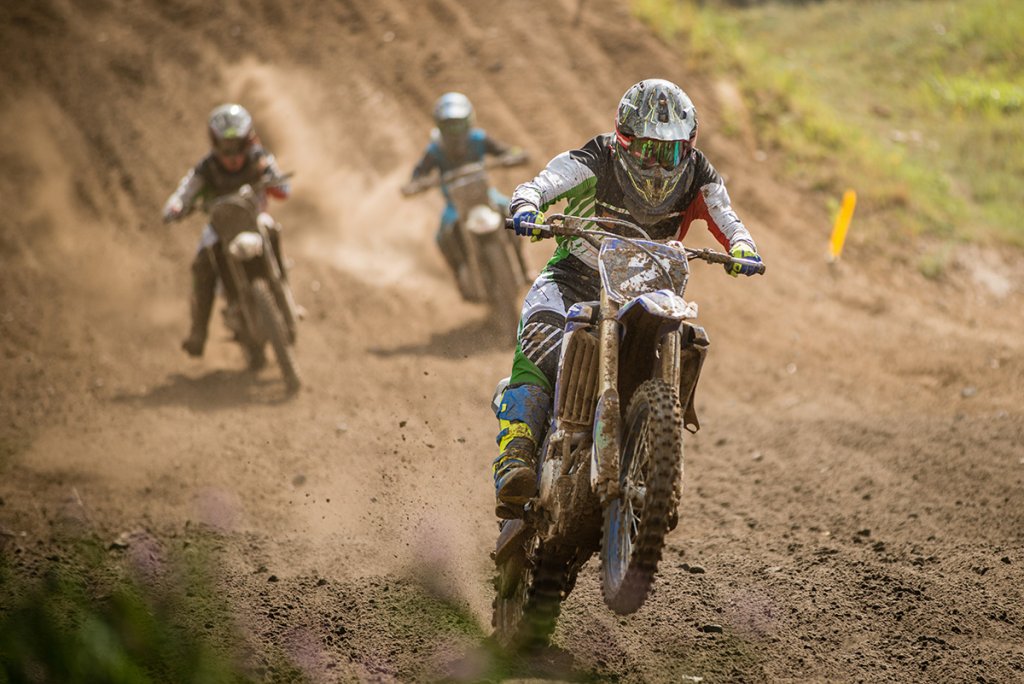 Motocross racers on dirt track