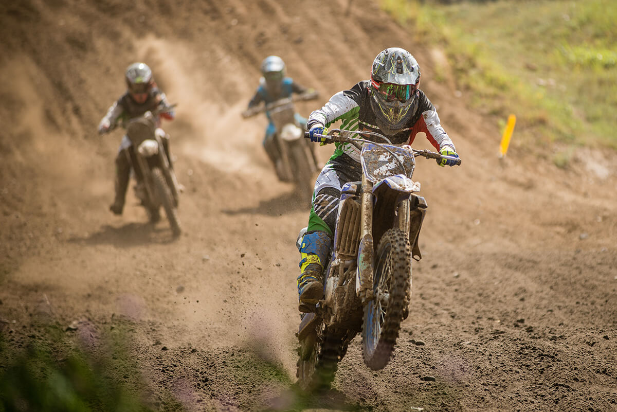 Motocross racers on dirt track