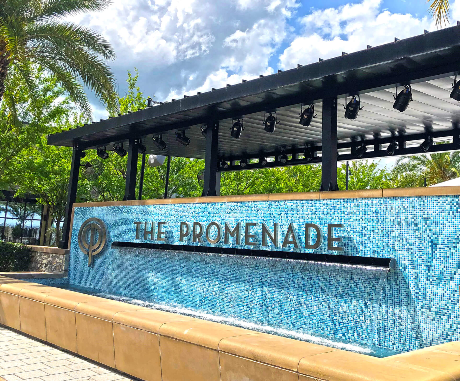 the promenade sign and water feature at celebration pointe