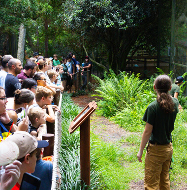 zookeeper talking to a crowd of people